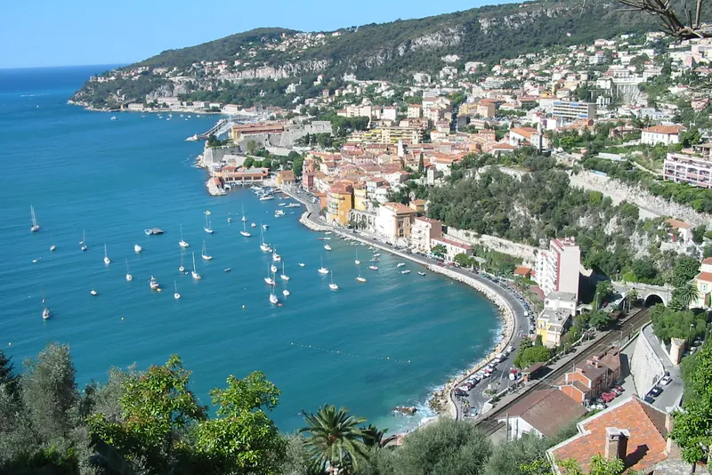 The deep-water bay of Villefranche-sur-Mer with ochre houses above the harbour