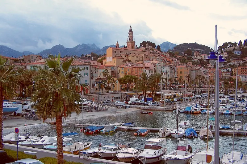 The pastel old town of Menton stacked above its harbour
