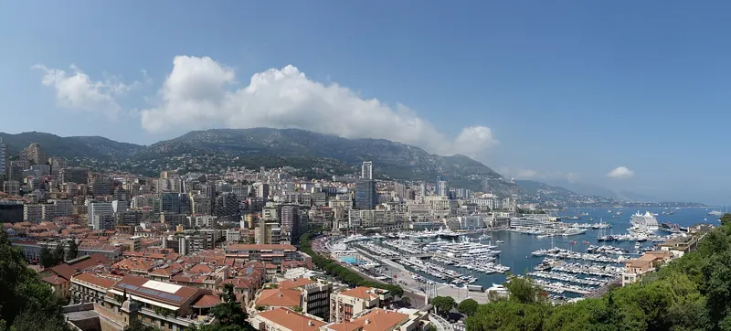 The dense high-rise waterfront of Monaco below the hills