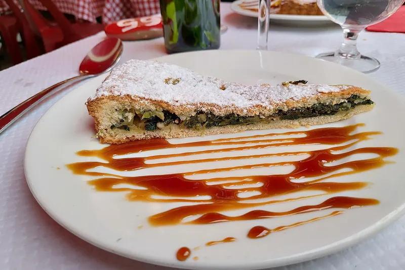 A tourte de blettes dusted with icing sugar