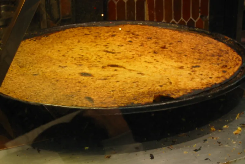 A portion of socca served on paper in Nice