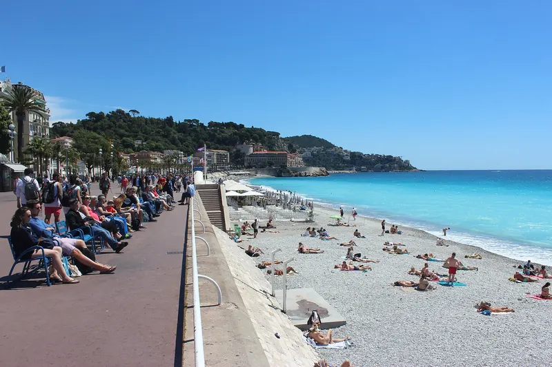 The curving seafront of the Promenade des Anglais along the Baie des Anges in Nice