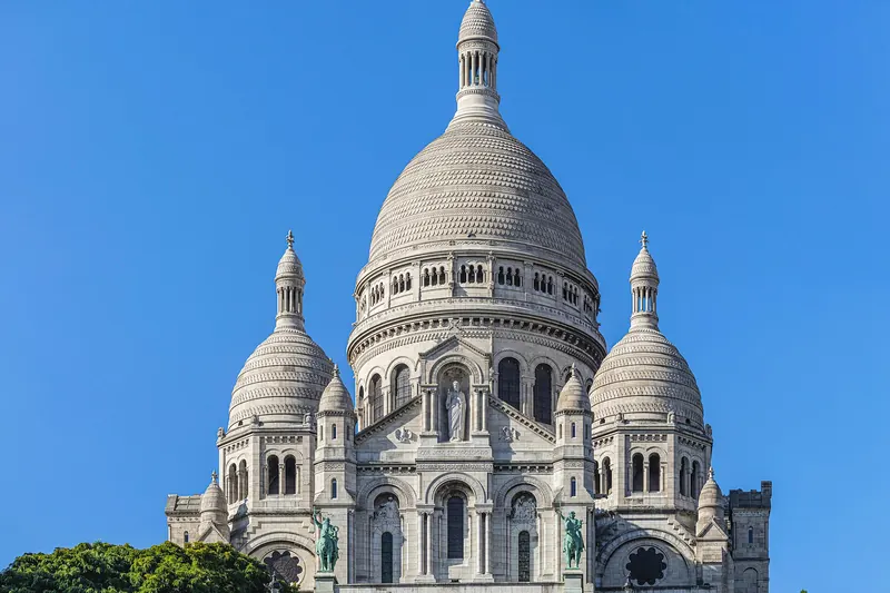 The white domes of the Sacré-Cœur basilica above Montmartre