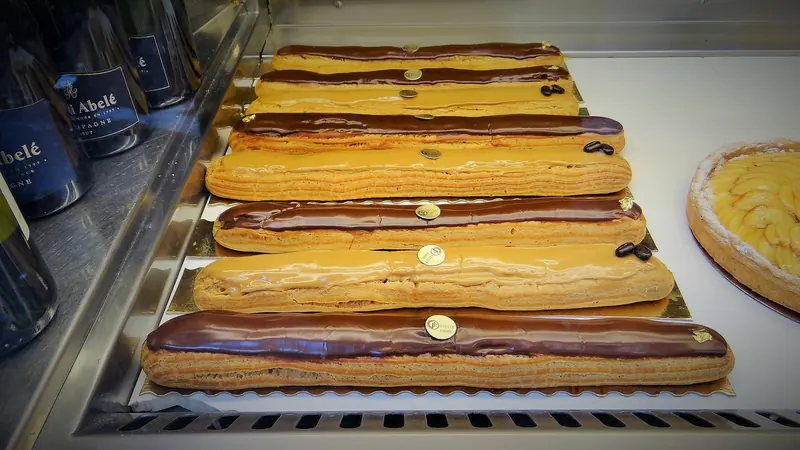Chocolate-glazed éclairs in a pâtisserie window