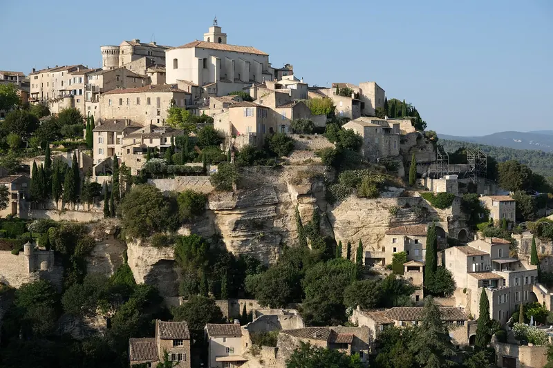 The pale stone village of Gordes spiralling up its rock face