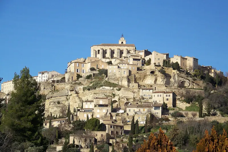 The stone village of Gordes stacked up a hillside above the Luberon valley