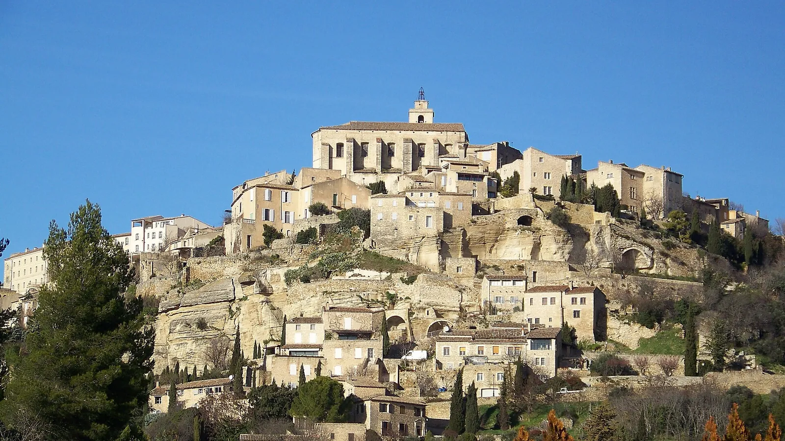 The stone village of Gordes stacked up a hillside above the Luberon valley