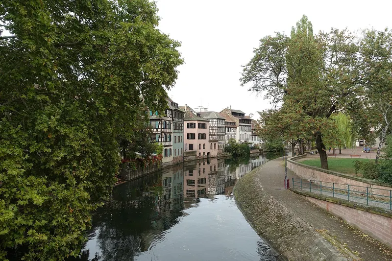 Half-timbered houses reflected in a canal in the Petite France quarter of Strasbourg