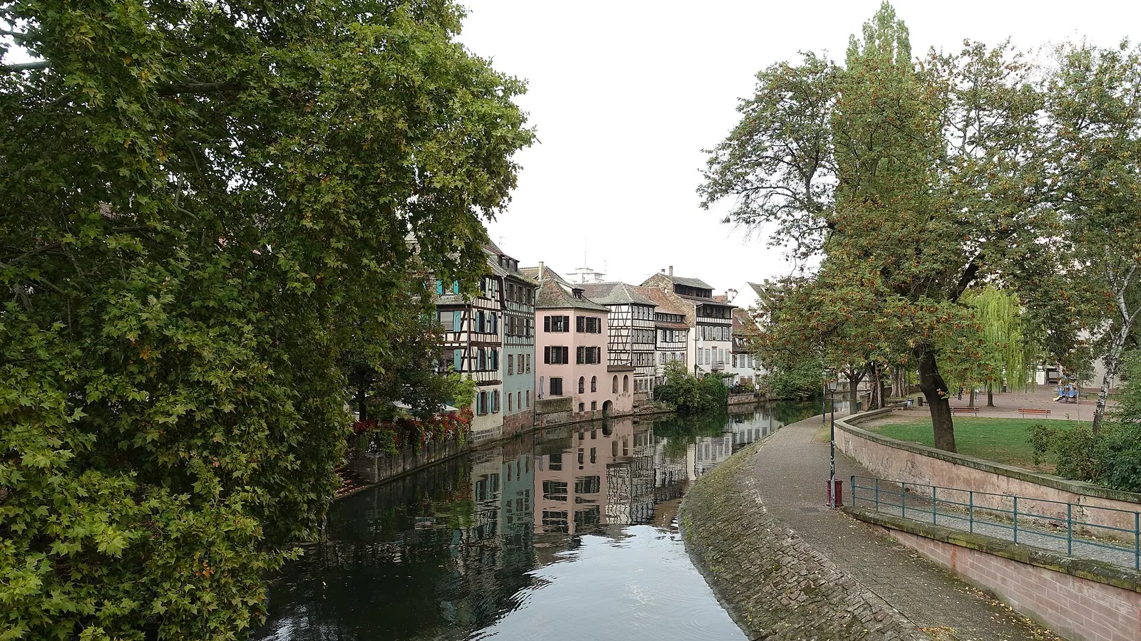 Half-timbered houses reflected in a canal in the Petite France quarter of Strasbourg
