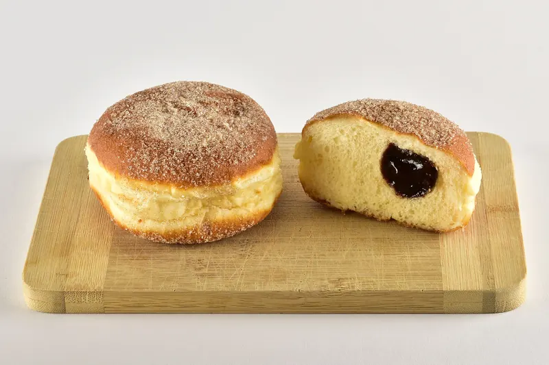 A sugar-dusted, jam-filled Berliner doughnut