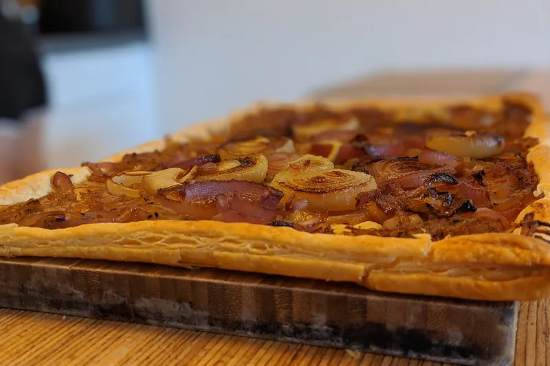 A slice of Zwiebelkuchen savoury onion tart