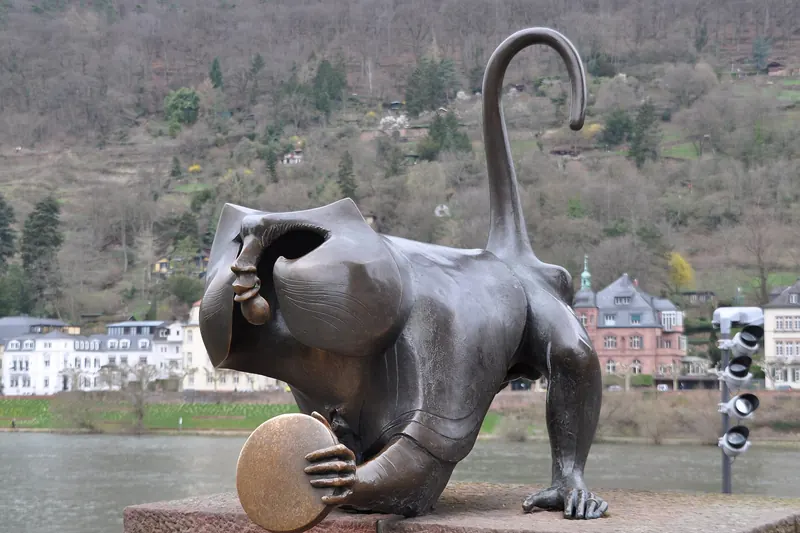 The bronze bridge monkey statue at the old town end of Heidelberg's Old Bridge