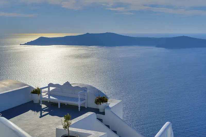 Santorini's whitewashed villages above the volcanic caldera at sunset