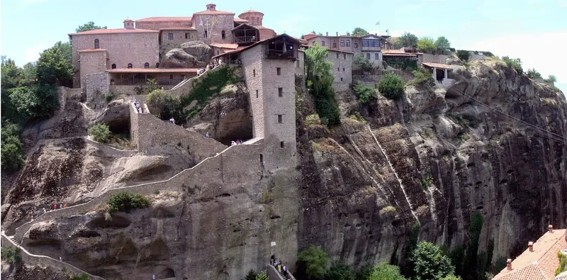 A monastery perched atop a sandstone pillar at Meteora