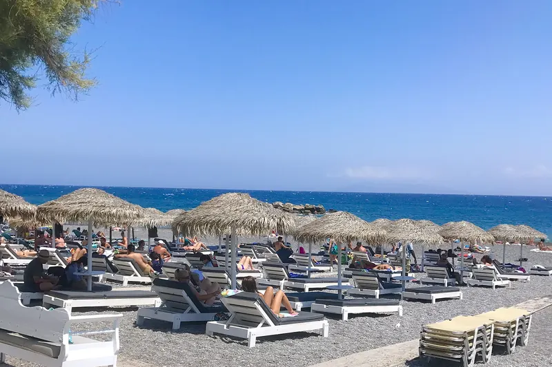 Kamari's black sand beach on Santorini