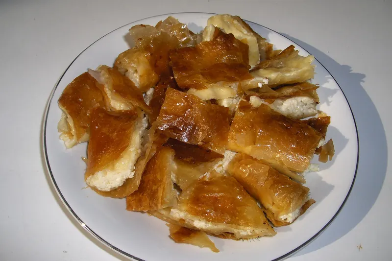 Bougatsa, a filo pastry filled with custard, cheese or meat