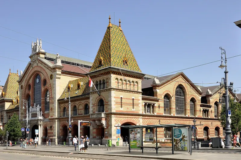 The interior of Budapest's Great Market Hall with stalls under an iron roof
