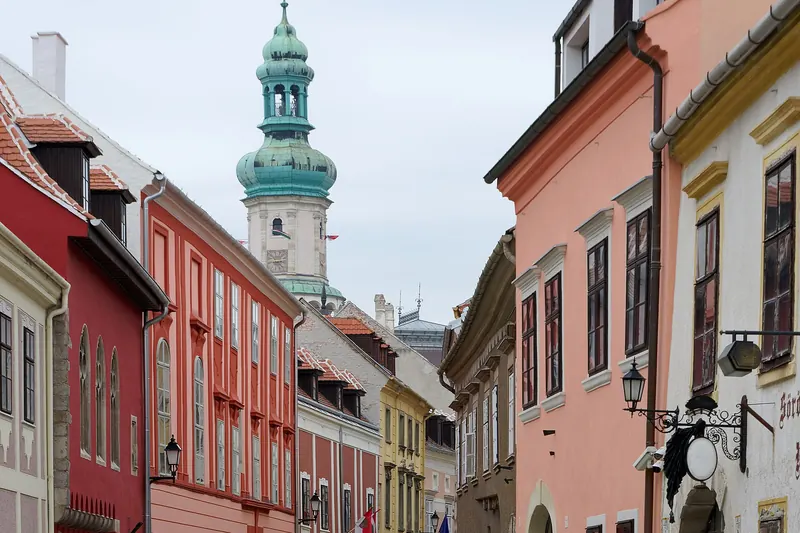 A street in the old town of Sopron with historic buildings