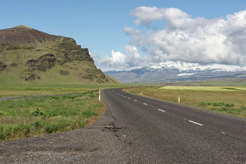 A stretch of Iceland's Ring Road running through open volcanic landscape