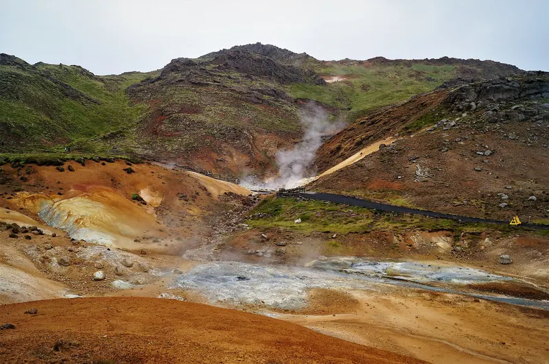 Colourful mineral-stained ground and steam vents at the Seltún geothermal field