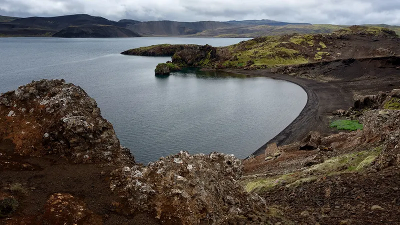 Lake Kleifarvatn surrounded by dark volcanic hills