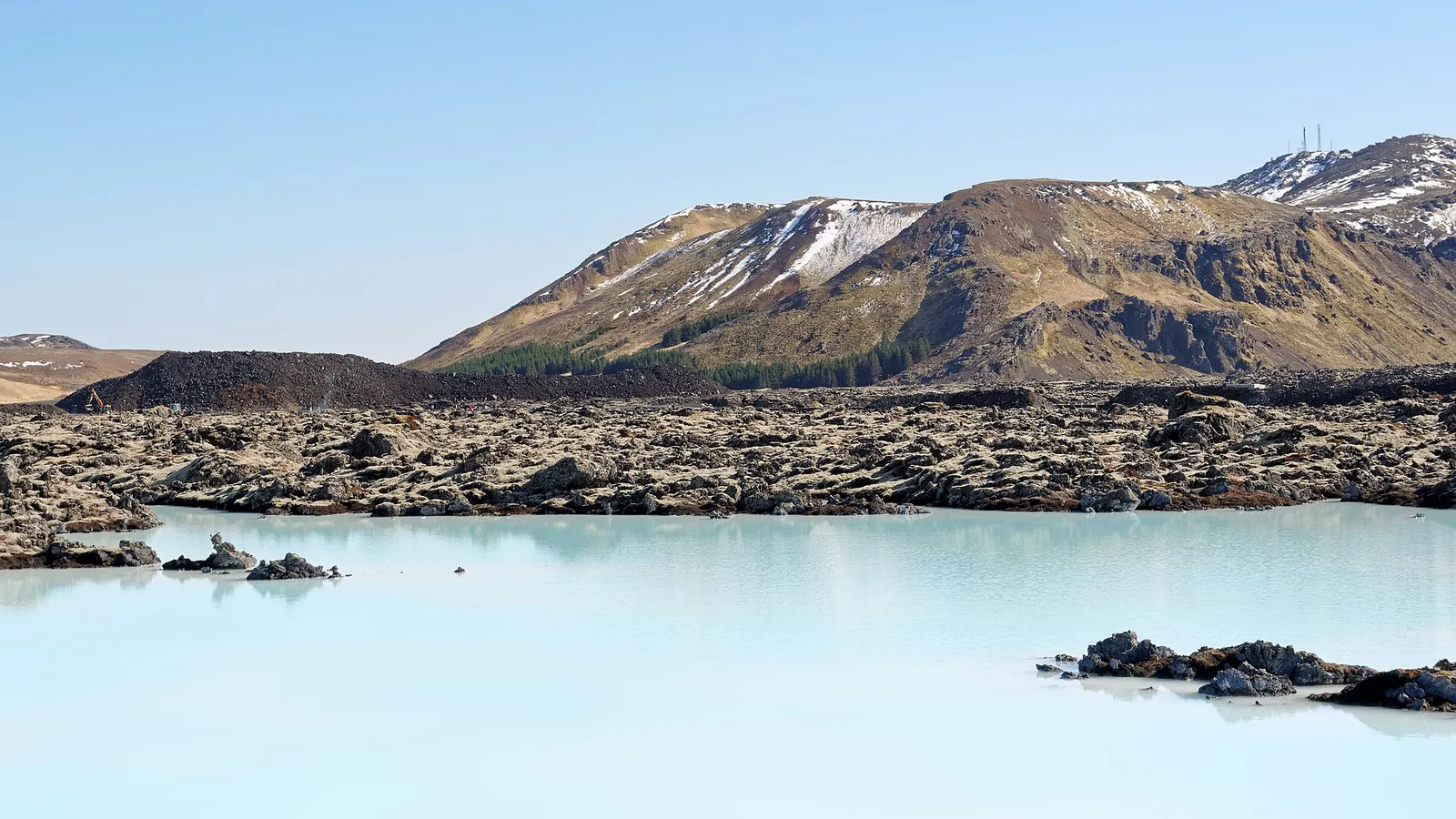 The Blue Lagoon's milky-blue geothermal water with Mount Þorbjörn behind it
