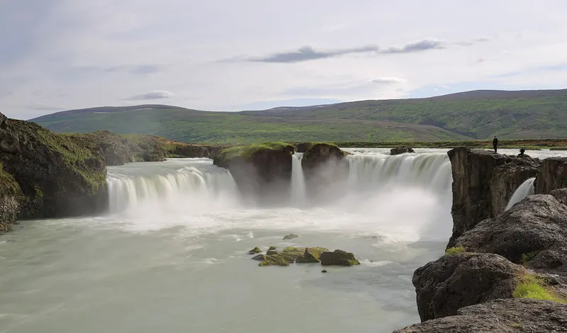 Goðafoss waterfall curving over a horseshoe-shaped basalt cliff