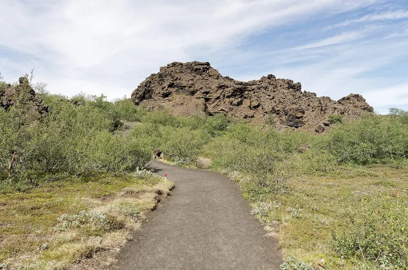 A walking path winding through Dimmuborgir's lava formations