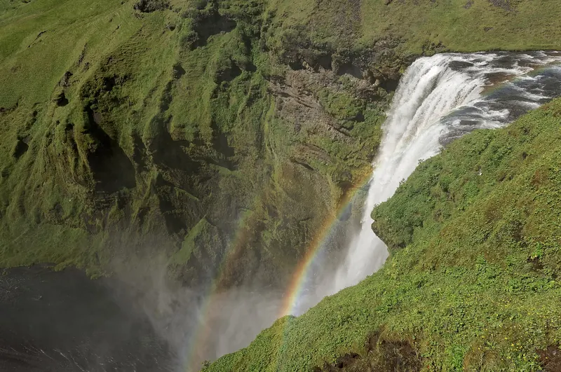 Skógafoss waterfall dropping 60 metres in a wide curtain