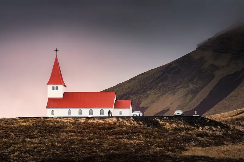 Vík's white church overlooking the village and the coastline