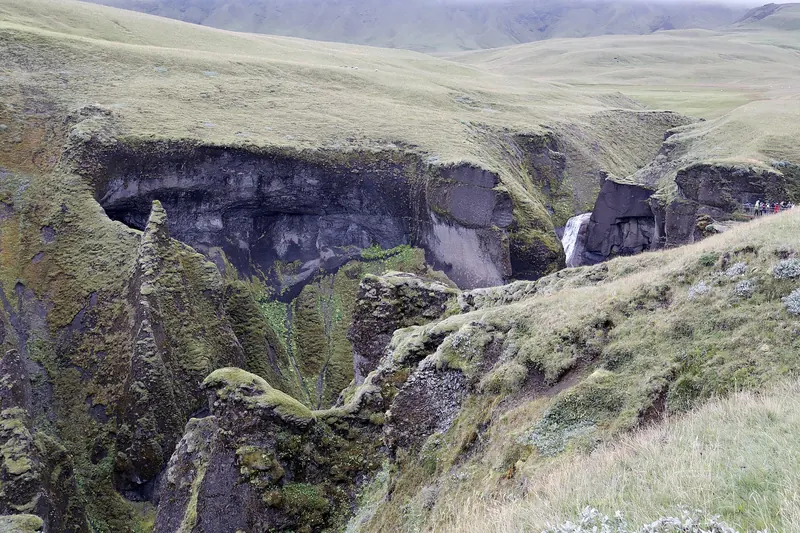 Hiking the rim trail above Fjaðrárgljúfur Canyon