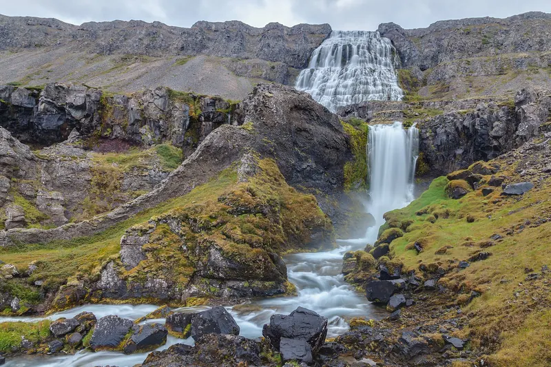Dynjandi, a tiered waterfall cascading down a mountainside in the Westfjords