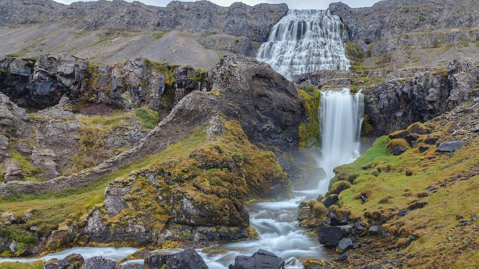 Dynjandi, a tiered waterfall cascading down a mountainside in the Westfjords