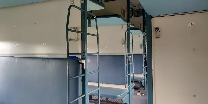 The inside of a sleeper coach on an Indian Railways train
