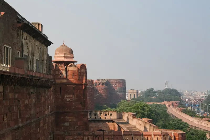 The massive red sandstone walls of Agra Fort