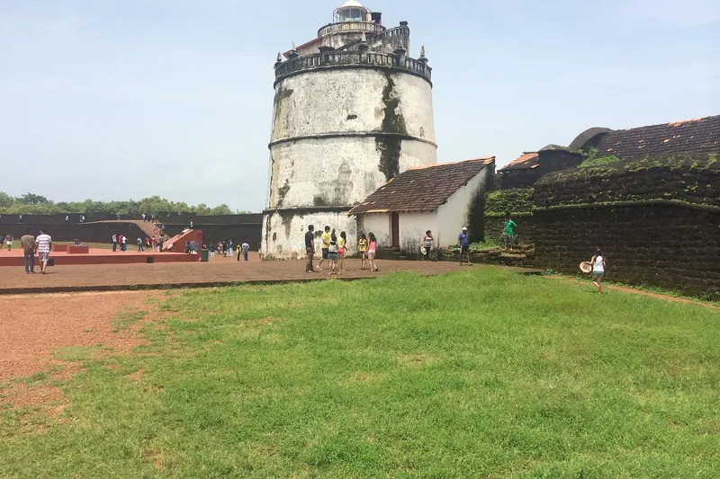 The old Portuguese Fort Aguada and its lighthouse above the sea