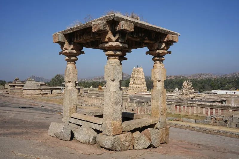 The gopuram of the Virupaksha Temple rising among boulders on Hemakuta Hill in Hampi