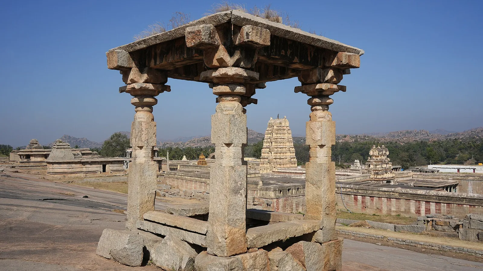 The gopuram of the Virupaksha Temple rising among boulders on Hemakuta Hill in Hampi