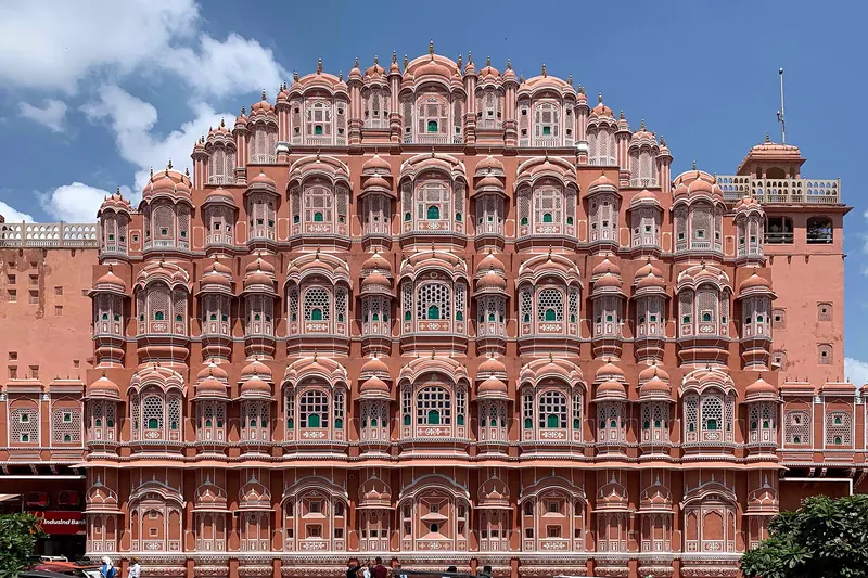 The pink sandstone honeycomb façade of the Hawa Mahal in Jaipur
