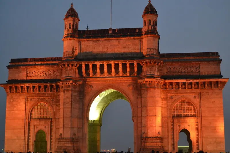 The Gateway of India monument by the harbour in Mumbai in the evening