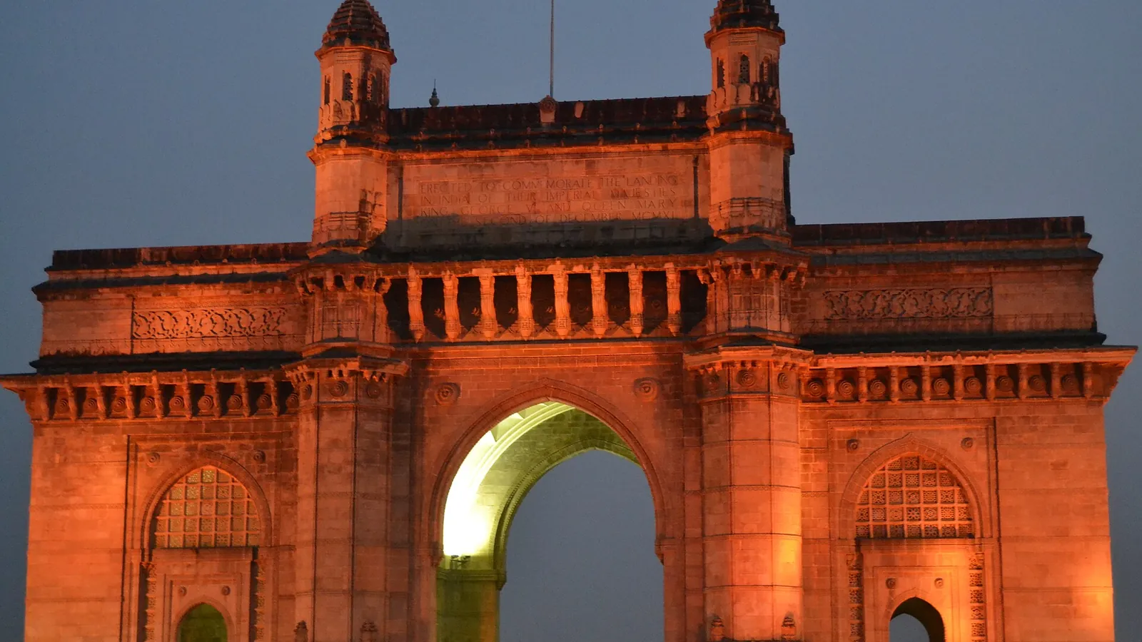 The Gateway of India monument by the harbour in Mumbai in the evening