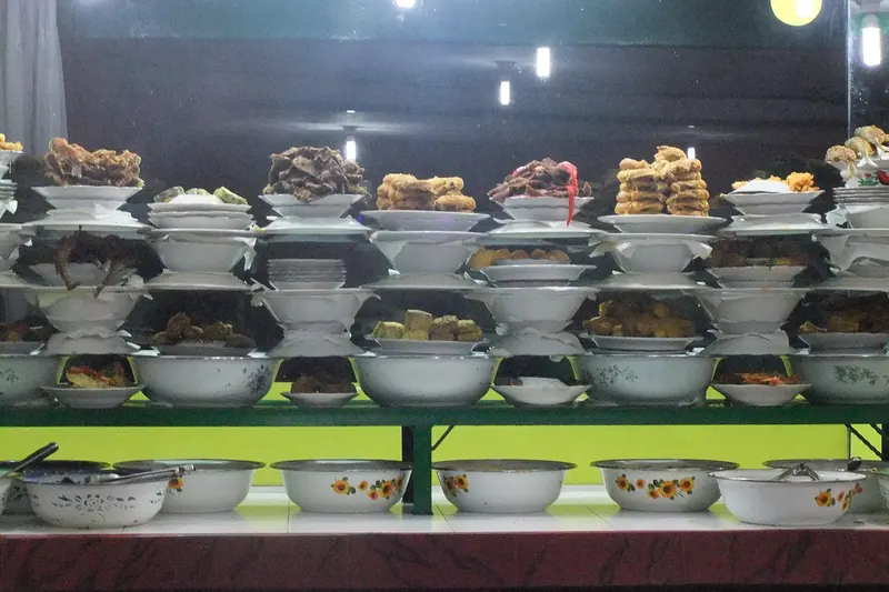 An array of nasi padang dishes served alongside rice