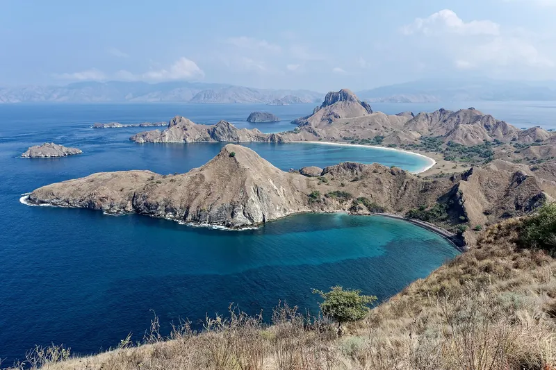 The dramatic multi-bay silhouette of Padar Island in Komodo National Park, Indonesia