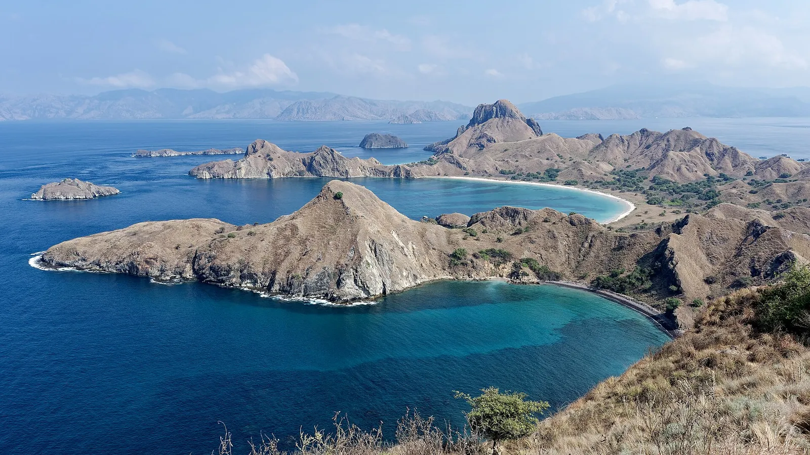 The dramatic multi-bay silhouette of Padar Island in Komodo National Park, Indonesia