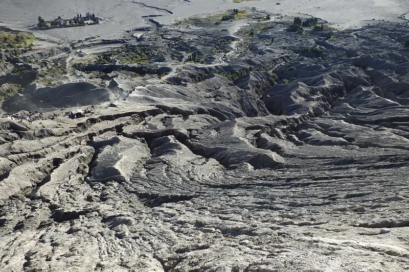 The vast grey volcanic Sea of Sand surrounding Mount Bromo