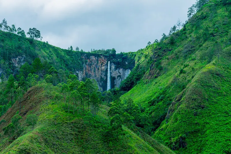 Sipiso-piso, a tall waterfall dropping toward Lake Toba