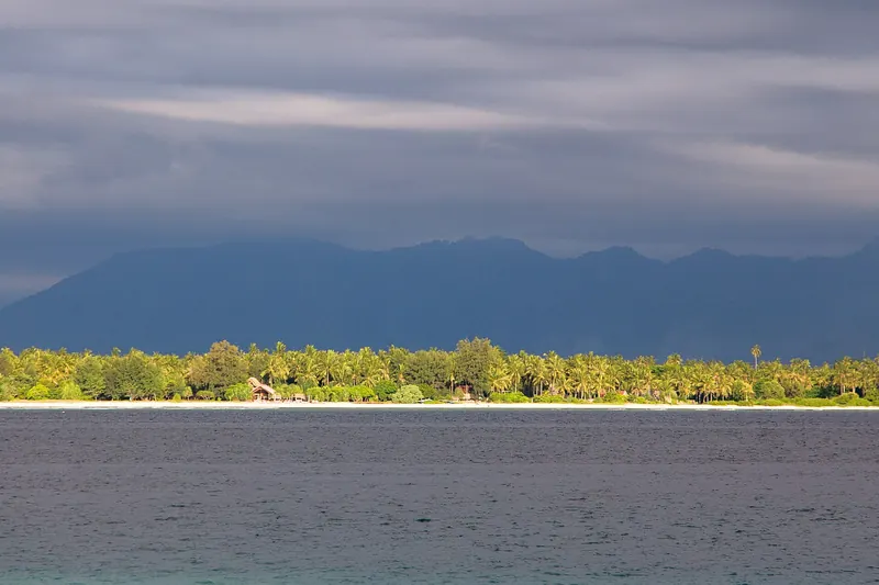 The beach and palm trees of Gili Air island