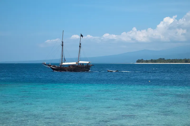 A boat sailing between the Gili Islands