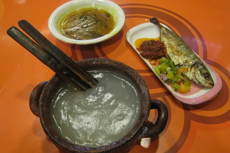Papeda, a sago starch dish, served with yellow fish soup
