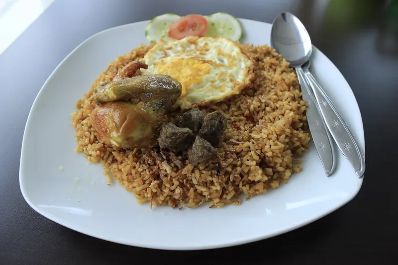 A plate of nasi goreng, Indonesian fried rice, topped with a fried egg
